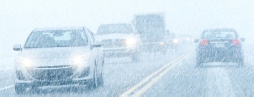 Photo of cars driving in the snow