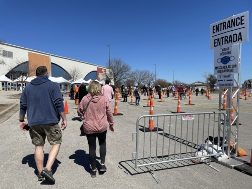 People wait in line to receive a vaccine at an Austin Public Health vaccination site. (Nicholas Cicale/Community Impact Newspaper)