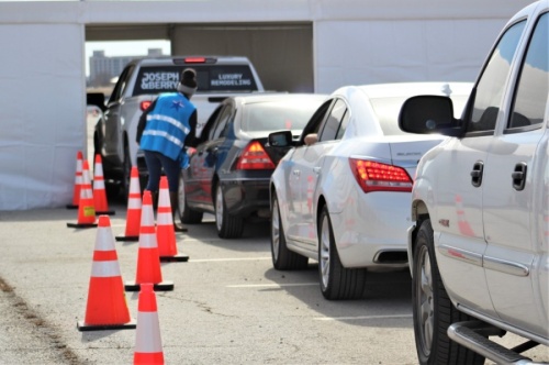 Cars wait their turn for a vaccine dose at the Texas Motor Speedway, on Feb. 2. The hub was hosted by Denton County Public Health. (Sandra Sadek/Community Impact Newspaper)