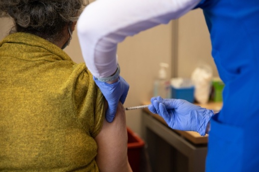 Texas Health Resources nurse Karen Schmidt administers a Pfizer vaccination to Plano resident Connie Cordova Feb. 5. (Liesbeth Powers/Community Impact Newspaper)