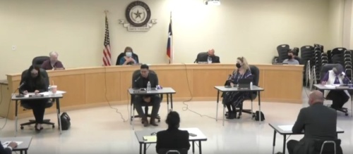 San Marcos CISD District 1 board trustee Miguel Arredondo (center left forefront) addressed the board during a March 8 meeting. (Screen shot courtesy SMCISD)