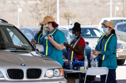 Photo of nurses giving drive-thru vaccines