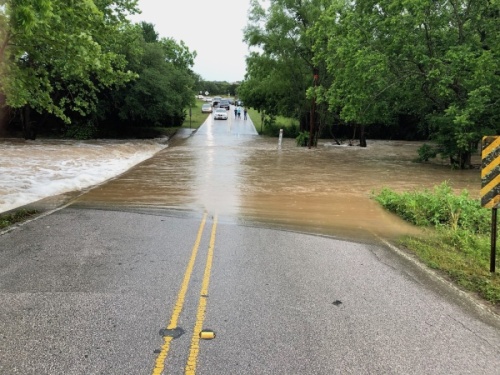The low-water crossing at Great Divide Drive was flooded by Little Barton Creek in May 2019. An engineering firm hired by the city of Bee Cave to study a bridge crossing at the site has been asked to bring a specific recommendation to the next City Council meeting. (Courtesy James Cooke)