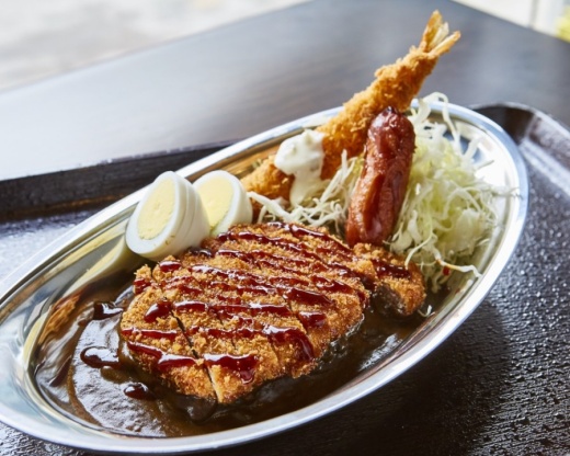 The restaurant serves a Japanese-style brown curry originating from the city of Kanazawa that is characterized by short-grain rice with a side of shredded cabbage and topped with pork or chicken katsu. (Courtesy Go Go Curry)