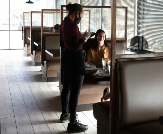 According to a March 4 news release, the updated guidance includes a face covering requirement for employees and encourages guests to wear a face covering when they are not seated at their table. The updated guidance also maintains key safety protocols like regular cleaning and disinfecting, hand-sanitizing stations, and employee and customer health screenings. (Liesbeth Powers/Community Impact Newspaper)