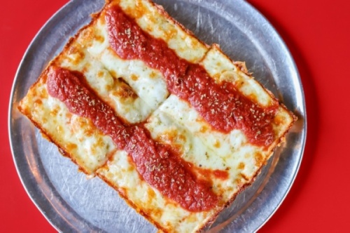 The restaurant specializes in Detroit-style pies and serves pizza, salads, appetizers and desserts as well as houses a full bar. (Courtesy Consumable Content)