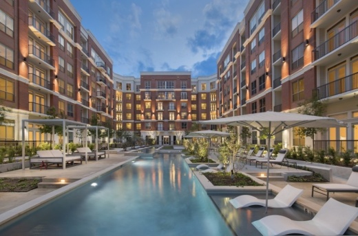 The Mark at CityPlace Springwoods Village features a resort-style pool with a separate lap pool, cabanas, and outdoor kitchen and dining areas. (Courtesy Public Content)