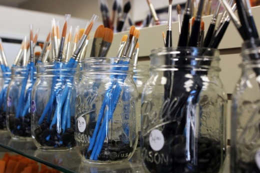 jars with paint brushes