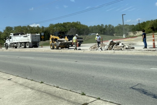 Bee Cave city maintenance crew members are rebuilding the existing median at Bee Cave Parkway and Bee Cave Road to make room for a longer left-turn for eastbound motorists heading north on Bee Cave Road. (Greg Perliski/Community Impact Newspaper)