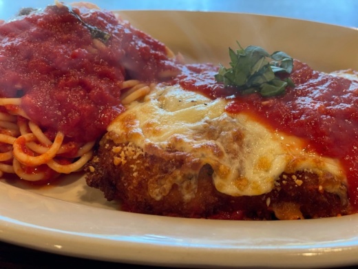 The chicken Parmesan ($6) is dipped in Parmesan breading, topped with marinara sauce and mozzarella cheese, and served over spaghetti. (Courtesy Raymond Green)