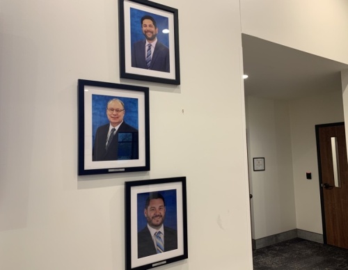 Outside of Hutto City Council Chambers there is a vacant spot where former Council Member Patti Martinez's framed picture used to hang. (Megan Cardona/Community Impact Newspaper)
