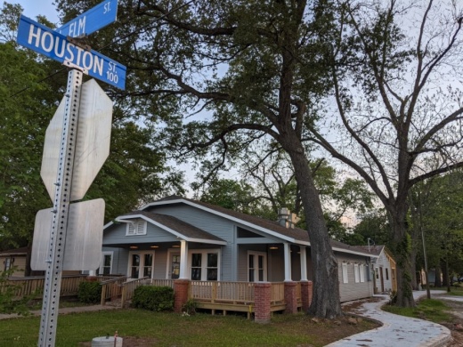 Managing partners and siblings Bryan Hutson and Teresa Latsis said The Hutson Group is adding sidewalks on Houston Street with plans for other walkability improvements to accompany building renovations from North Elm to Walnut streets. (Anna Lotz/Community Impact Newspaper)