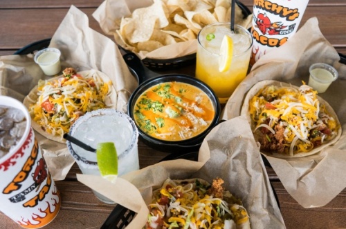 Torchy's Tacos serves a variety of unique taco offerings alongside chips and queso, street corn, guacamole and salsa. (Courtesy Torchy's Tacos) 