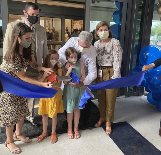 Amber Cessac (left) and her daughters help cut the ribbon at the Dell Children’s Medical Center Specialty Pavilion on April 29. (Nicholas Cicale/Community Impact Newspaper)
