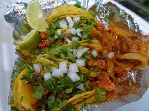 Street tacos include mini corn tortillas filled with a choice of meat along with charro beans, cilantro and grilled onions. (Danica Lloyd/Community Impact Newspaper)