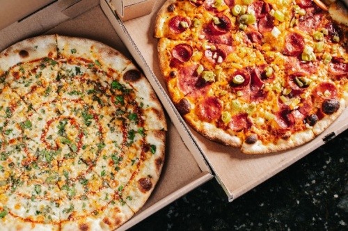Zalat Pizza offers an elote pizza and the OG, which is topped with all-beef pepperoni, salami, cracked black pepper and pickled giardiniera. (Courtesy Alison Taylor/Strauss Marketing-PR)