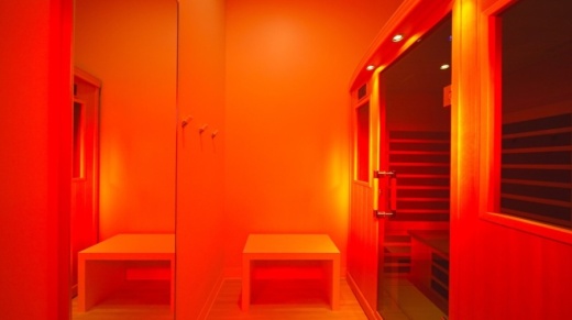A sauna filled with red light