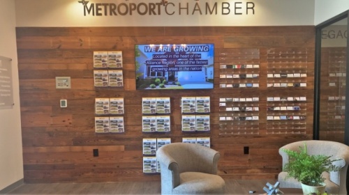 The Metroport Chamber of Commerce lobby allows members to post their business cards on the wall to share. (Sandra Sadek/Community Impact Newspaper)