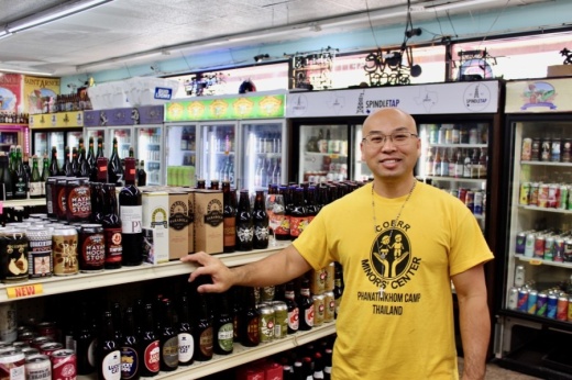 Brandon Nguyen owner of D&Q The Beer Station on Richmond Avenue, can guide overwhelmed newbies and beer veterans alike on the selections at his one-stop shop. (Matt Dulin/Community Impact Newspaper)