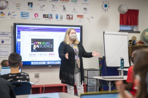 Wolford Elementary School fifth grade teacher Michele McGilvray welcomes students to her class on September 3, 2020. Next school year masks will be optional. (Courtesy McKinney ISD)