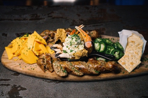 The boudin board at Studewood Grill comes with large-shred cheddar cheese and saltines. (Courtesy Studewood Hospitality)