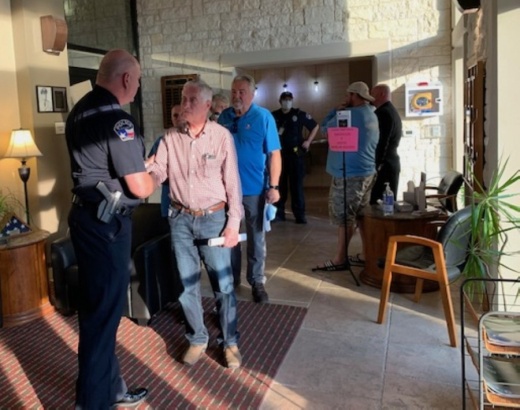 Lakeway Police Chief Todd Radford greets supporters May 17 following a council vote to accept his resignation. (Greg Perliski/Community Impact Newspaper)