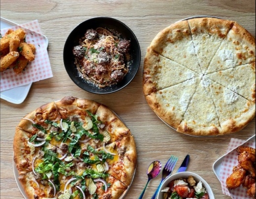 Photo of a table of pizza