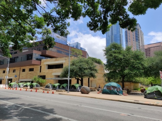 Several homeless encampments remain throughout downtown Austin, including a new group of tents that has surrounded City Hall since early May. (Ben Thompson/Community Impact Newspaper)