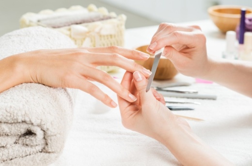a client receives a manicure