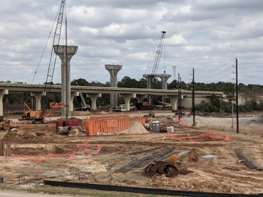 Columns are being constructed for the four flyovers linking Hwy. 249 and the Grand Parkway, and utilities are being adjusted. This image was taken in February. (Anna Lotz/Community Impact Newspaper)