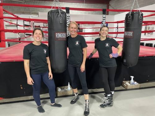 Austin Women's Boxing Club Owner Julia Gschwind (center) stands with instructors Ashley Bazan (left) and Alex Plichta. (Nicholas Cicale/Community Impact Newspaper)