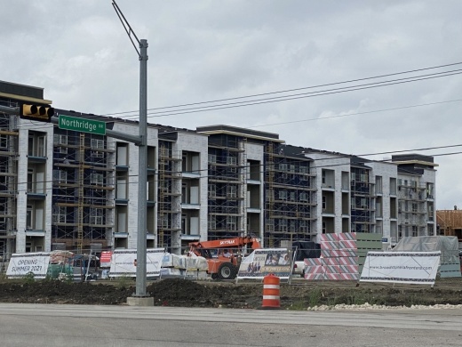 The luxury apartment community will offer one, two and three-bedroom units with private yard options and amenities such as a swimming pool, co-working space, private dining and party room and an onsite dog washing station. (Community Impact Newspaper/Brooke Sjoberg)