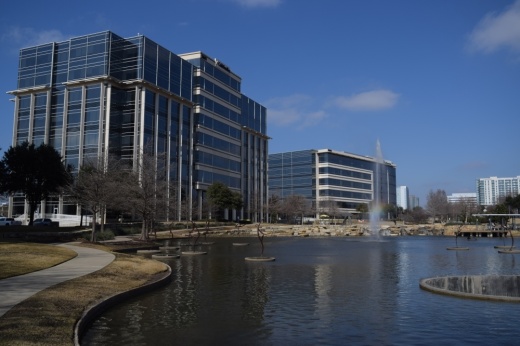 Hall Park building in Frisco and pond