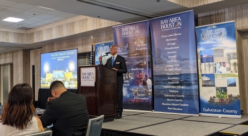 Houston Airport System Director Mario Diaz spoke during a Bay Area Houston Economic Partnership meeting June 2 about the future of the spaceport. (Jake Magee/Community Impact Newspaper)