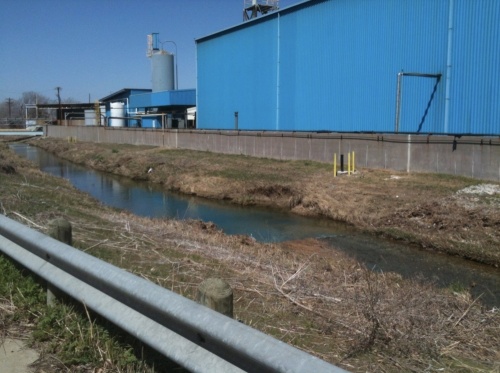 Exide Technologies’ battery recycling plant operations were located right next to Stewart Creek, as seen in this 2013 photo. All of the buildings at the site have since been taken down, but contamination of the site remains. (Courtesy Exide Technologies)
