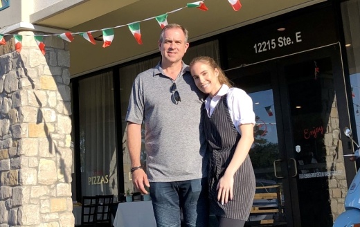 Dejan Medanic owns Tuscany Italian Bistro on Grant Road, where his daughter Claudia works as a server. (Andy Yanez/Community Impact Newspaper)