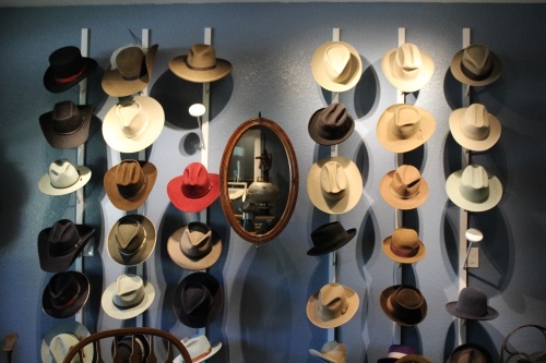 Walking inside the shop, a variety of hats are perched along the wall ranging from film noir fedoras to cowboys hats. (Megan Cardona/Community Impact Newspaper)
