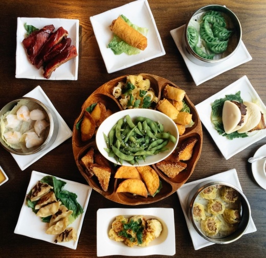aerial image of several plates with dishes offered by Howard Wang's China Grill