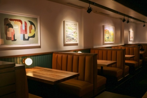 Booths and art prints in Towne Grill's dining room