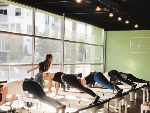 The reformer Pilates studio offers 50-minute classes that focus on quick transitions throughout a beat-based, high-intensity, full-body workout. (Courtesy Session Pilates)
