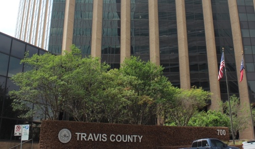 Photo of the Travis County building and sign