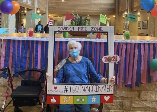 Photo of an elderly woman celebrating