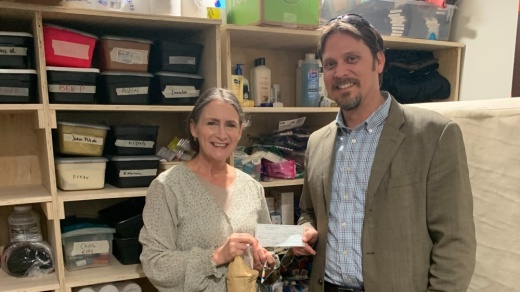 Kellie Stallings and Paster Jake Fain of Peace Lutheran Church stand in the shelter storage area. The church's Mission Endowment Fund supported the shelter. (Courtesy Kellie Stallings)