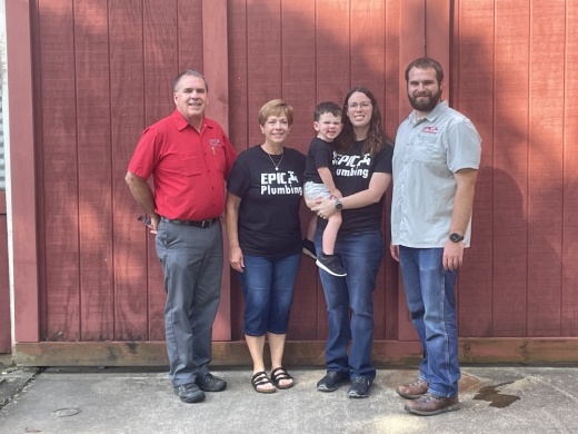 From left: Todd Iocco, Denesse Iocco, April Maly and Bryant Iocco own Epic Plumbing. In Maly’s arms is her son, Thomas Maly. (Haley Morrison/Community Impact Newspaper)