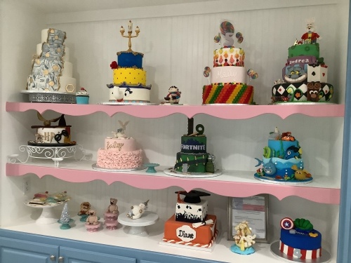 Custom cakes sit on a shelf at The Sweet Tooth Parlor Bakery & Cafe. (Courtesy Diane Pakula/The Sweet Tooth Parlor Bakery & Cafe)
