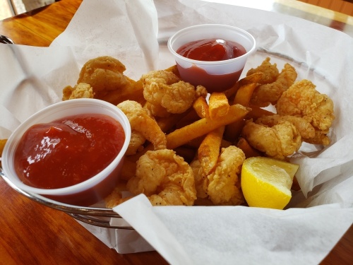 The fried shrimp basket ($10) comes with fries. (Ali Linan/Community Impact Newspaper)