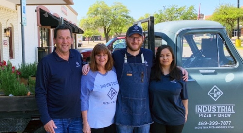 Kelly Newsom, left, and his wife, Becky, co-own the restaurant with their son, Hunter, and his wife, Mariana. (Courtesy Industrial Pizza   Brew)