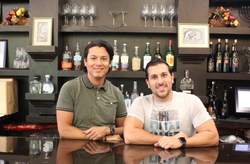 Manager David Tenorio (left) and owner Jason Goldstein (right) founded Genesis Steakhouse. (Savannah Kucher/Community Impact Newspaper)
