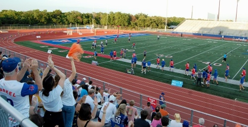 A Westlake crowd cheers for the Austin Sol during a June game against the Dallas Roughnecks at Westlake Chaparral Stadium. The Austin Sol plays in the American Ultimate Disc League. (Greg Perliski/Community Impact Newspaper)