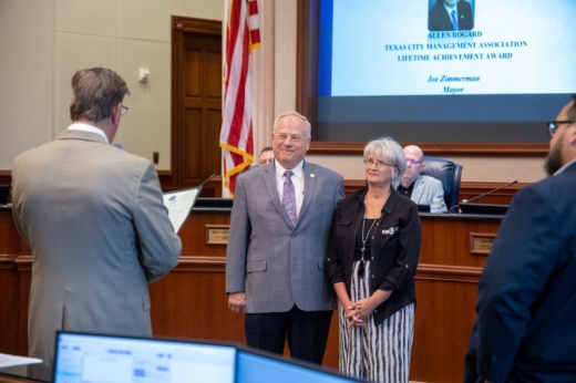 Sugar Land Mayor Joe Zimmerman (left) and City Manager Mike Goodrum (right) recognized former City Manager Allen Bogard and his wife, Claire Bogard, during the Aug. 3 City Council Meeting. (Courtesy city of Sugar Land)